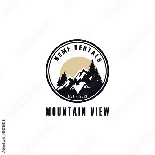 Vintage retro home rentals with mountain view logo design