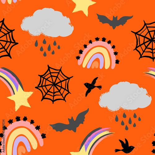 Halloween seamless vector repeat pattern in weather theme with rainbows, rain clouds, spider webs, bats and shooting stars on bright orange background. Trendy whimsical Halloween backdrop, non