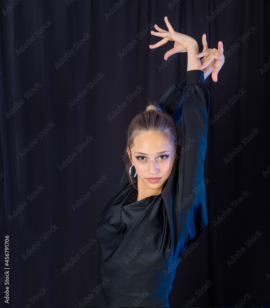 Attractive young girl dancing latino dance in studio Attractive young girl dancing latino dance in studio