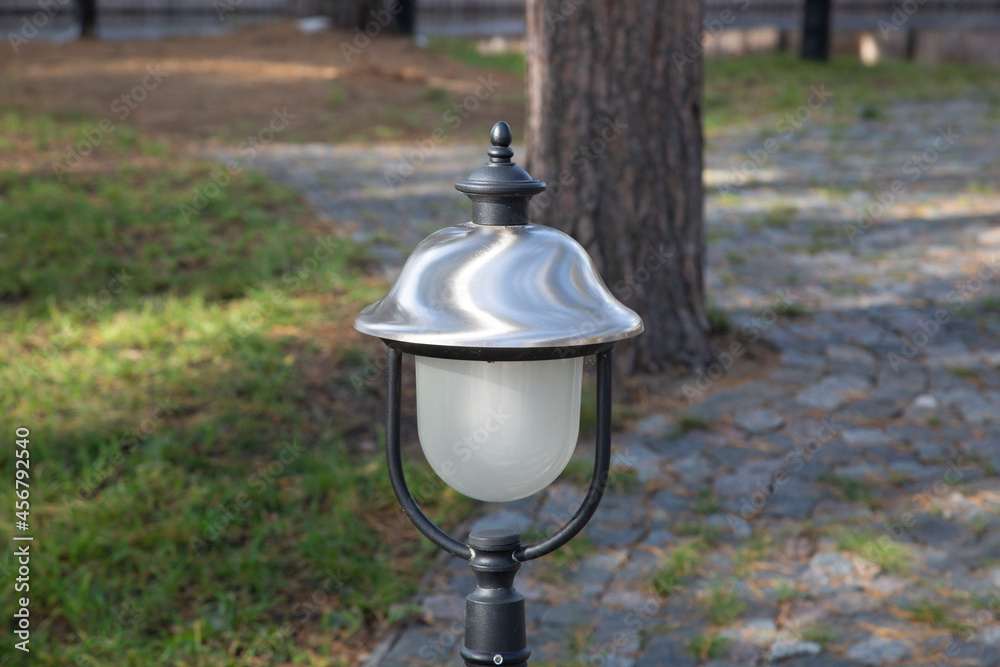 A lighting device in the park on the street.Street lighting devices.