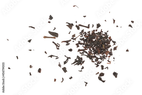 Dry black tea leaves pile isolated on white background, top view
