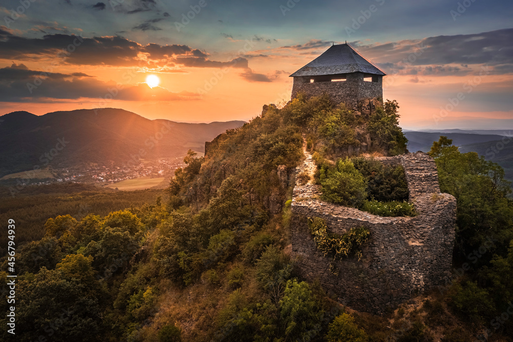 Salgotarjan, Hungary - Aerial view of the ruins of Salgo Castle (Salgo vara) in Nograd county with a beautiful dramatic sunset at summer time