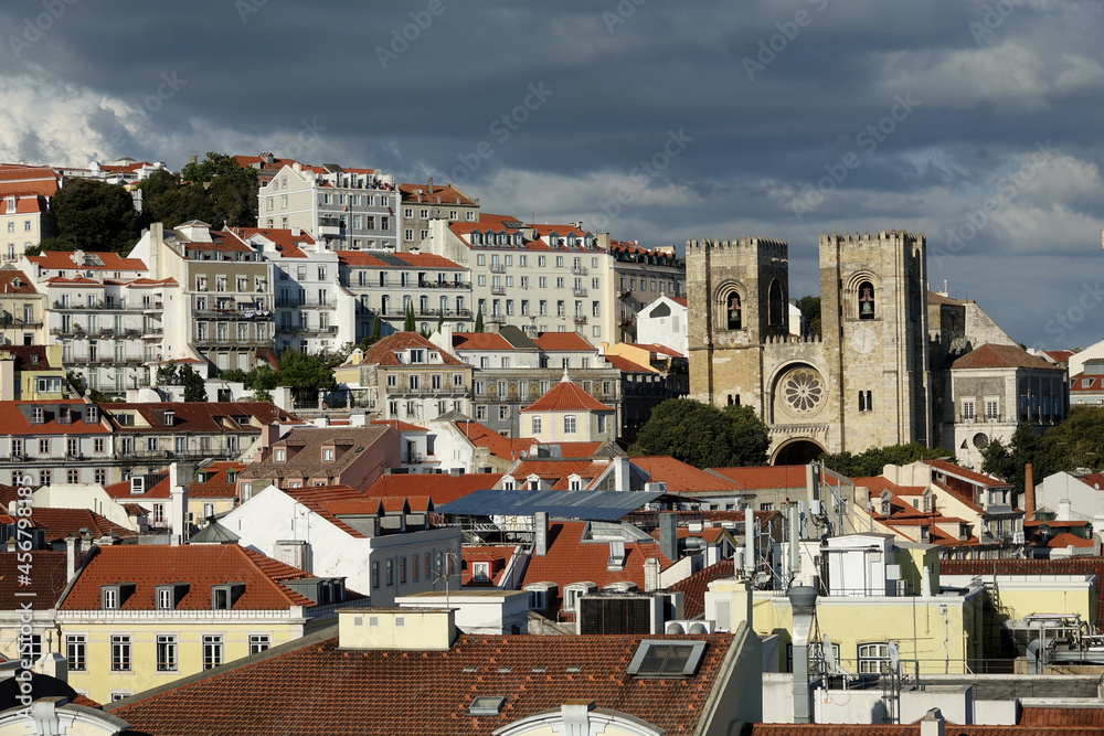 View of the Lisbon Cathedral between houses at sunset