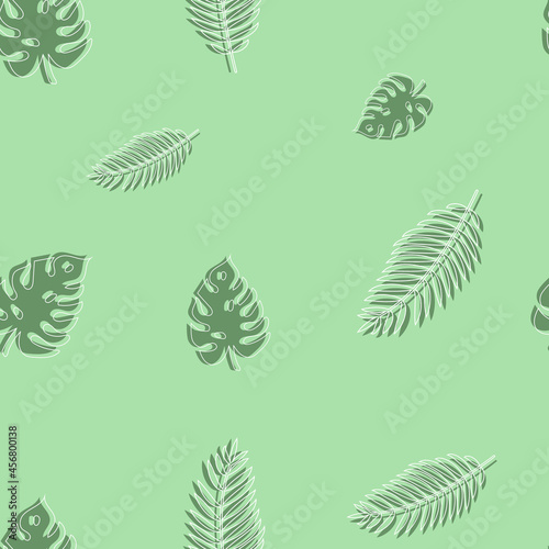seamless vector pattern of green leaves of monstera and fern on a green background. beautiful natural background
