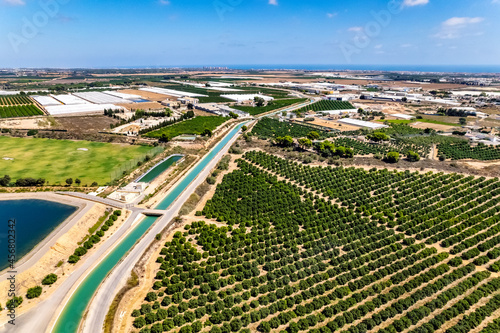 Aerial drone point of view Orihuela Costa with farmlands and countryside at sunny summer day. Murcia, south of Spain
