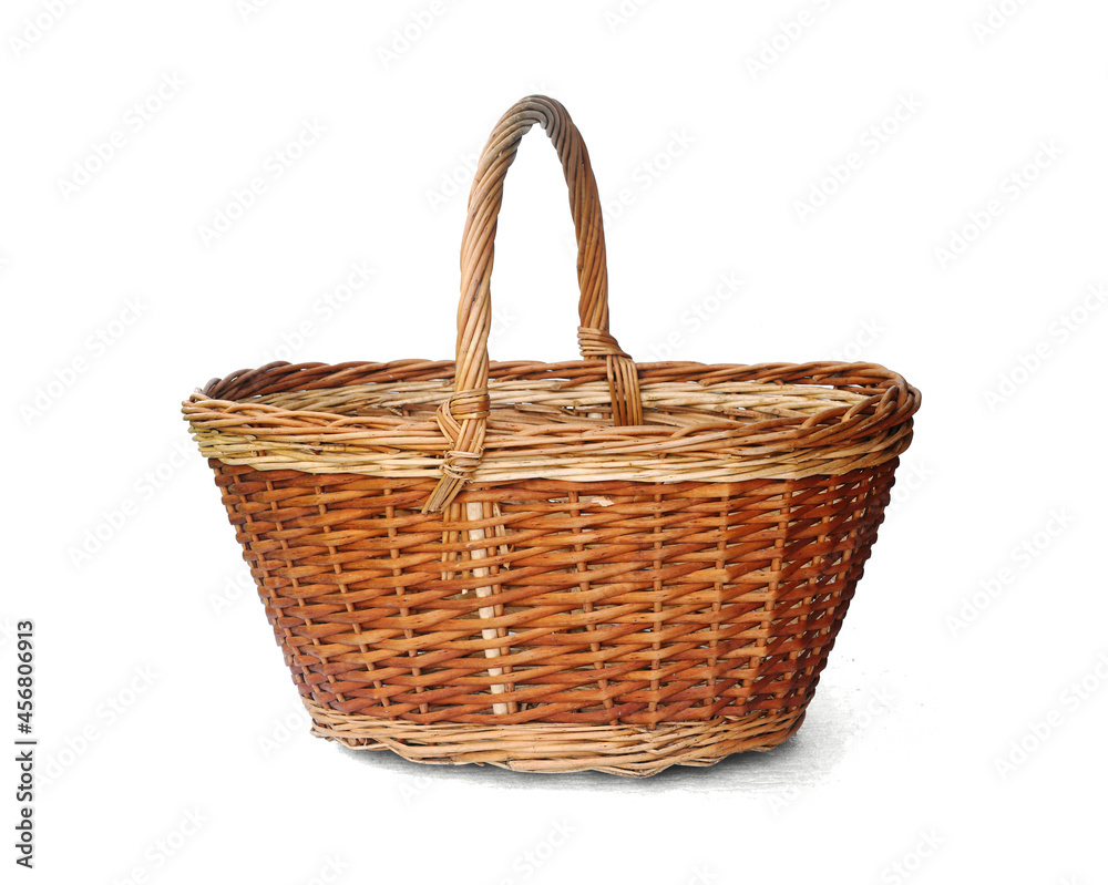 Oval empty wicker basket isolated on white background. Side view. Oval empty wicker basket isolated on white background. Side view.
