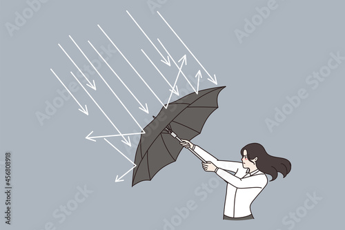 Business defending, challenge, strategy concept. Young business woman standing with umbrella and defending from arrows hitting her vector illustration 