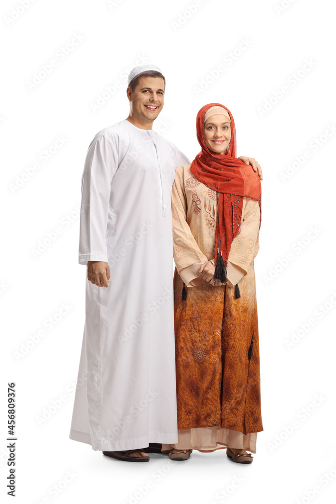 Full length portrait of a young couple in ethnic clothes smiling