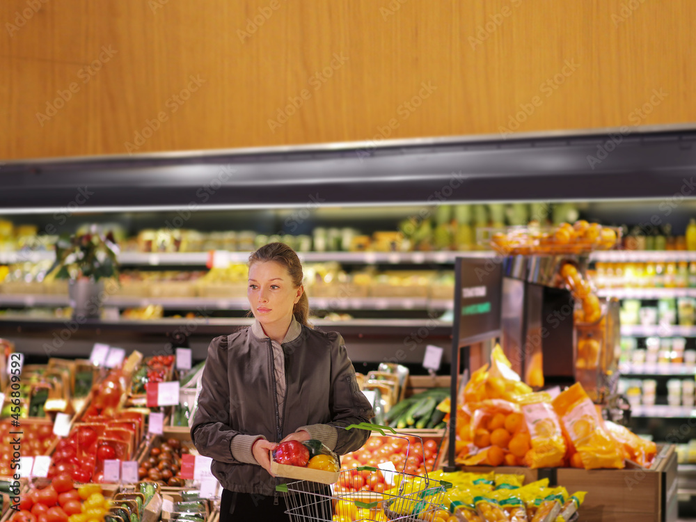 Woman buying vegetables at the market