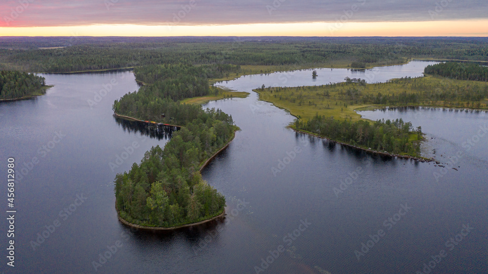 Northern nature. Panorama of the forest. Lake, forest, river. Beautiful landscape with lake and forest. Sunset and sunrise. Reflection of the forest in the water.