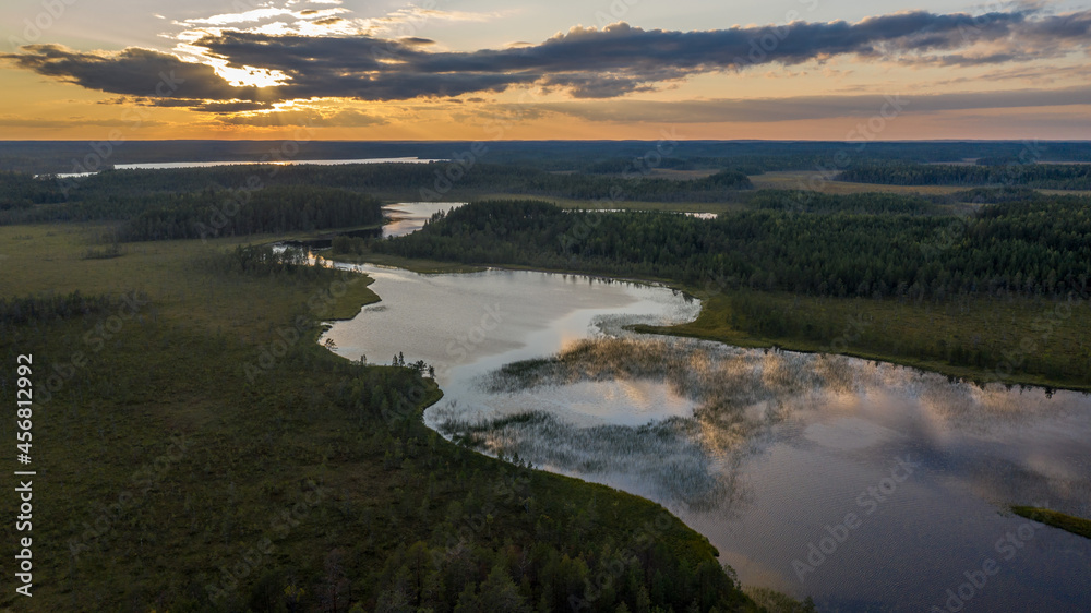 Northern nature. Panorama of the forest. Lake, forest, river. Beautiful landscape with lake and forest. Sunset and sunrise. Reflection of the forest in the water.