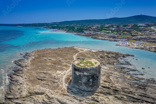 Aerial view of nuraghe in a island in Stintino, La Pelosa beach in Mediterranean sea. The nuraghe or also nurhag in English, is the main type of ancient megalithic edifice found in Sardinia.