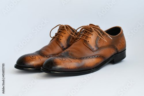Brown leather derby shoes isolated on white background