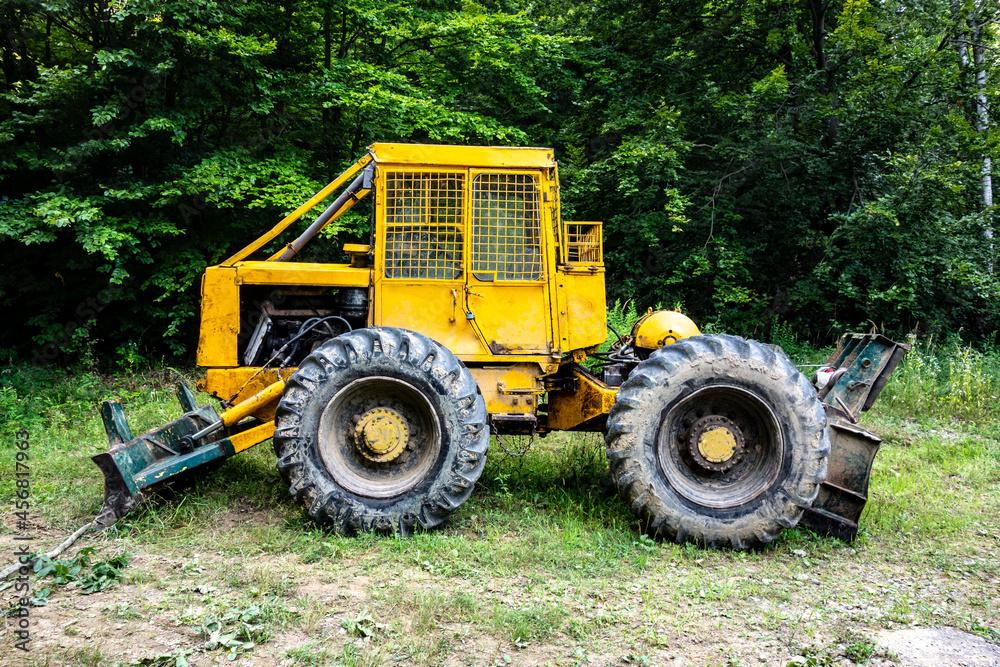 Forest tractor for logging after sawing trees, heavy forestry equipment Forest tractor for logging after sawing trees, heavy forestry equipment