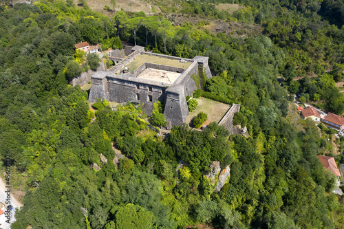 Old Aulla Brunella fortress landmark in Tuscany, Italy. The Brunella Fortress dominates the strategic Aulla village from on high, located where the river Magra and Aulella meet. photo