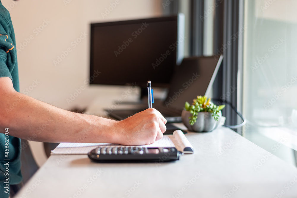 Fototapeta premium Casually dressed young man working remotely