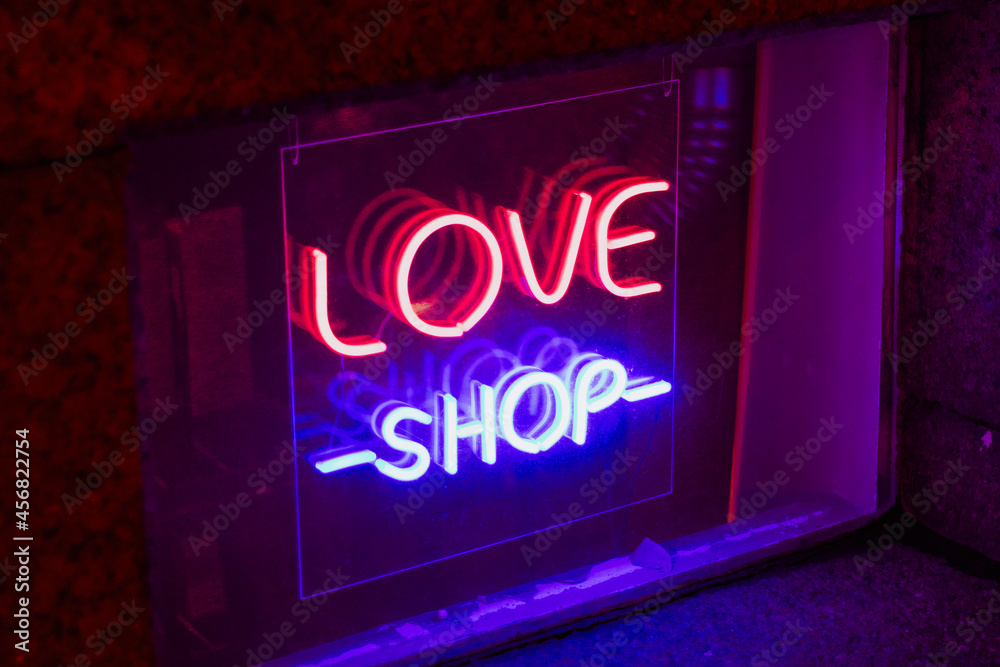 sex love shop neon sign showcase window glowing