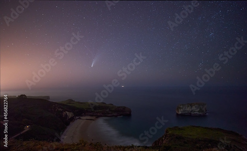 Comet NEOWISE streaking through the sky above the ocean from the Cantabrian sea. © JORGE CORCUERA