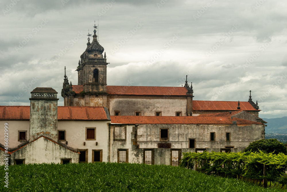 Side view of Monastery of Tibaes on a cloudy day, famous religious place of Minho region - Braga, Portugal