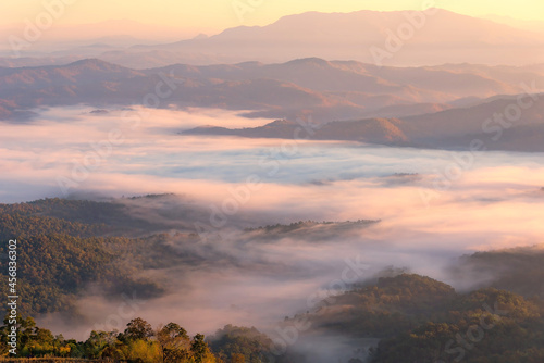 Mountain Aerial View. mountain landscape in the fog.Beautiful sunlight and fog © tonjung