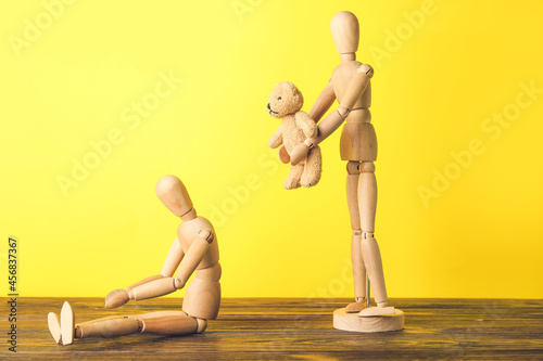 Wooden mannequins on color ...