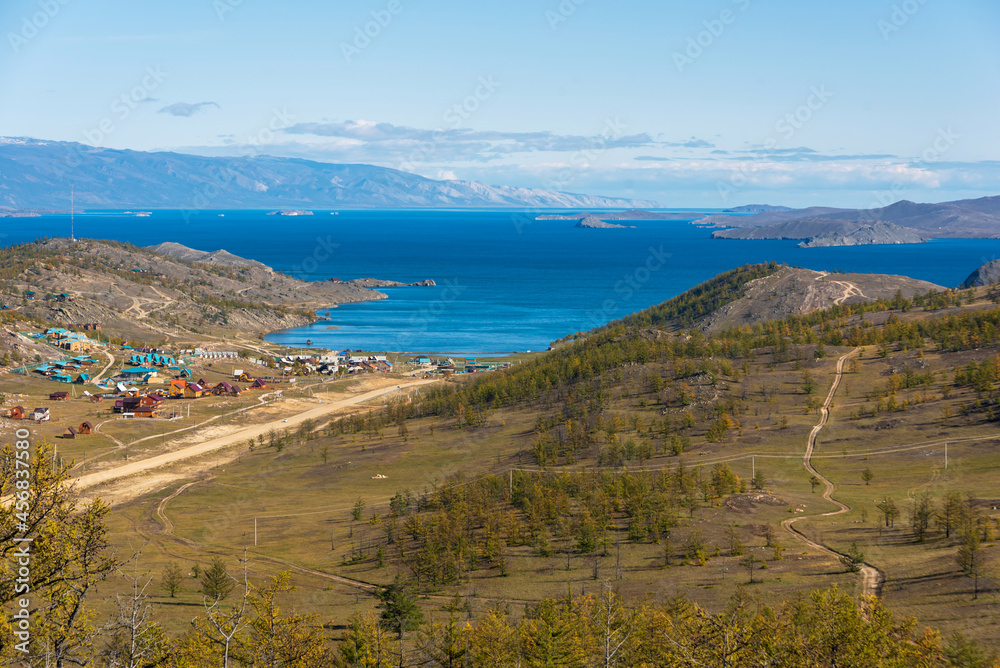 View of Small Sea Strait on Lake Baikal on autumn day, Joy Bay with houses