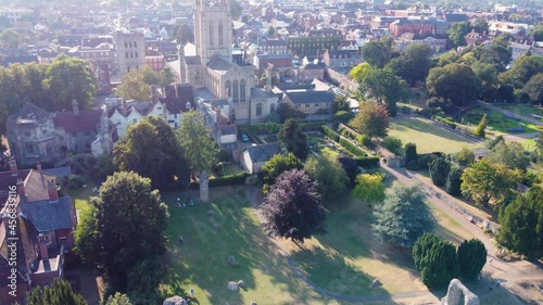 Aerial City: St Edmunds bury Cathedral with garden stone, drone flying forward top shot photo