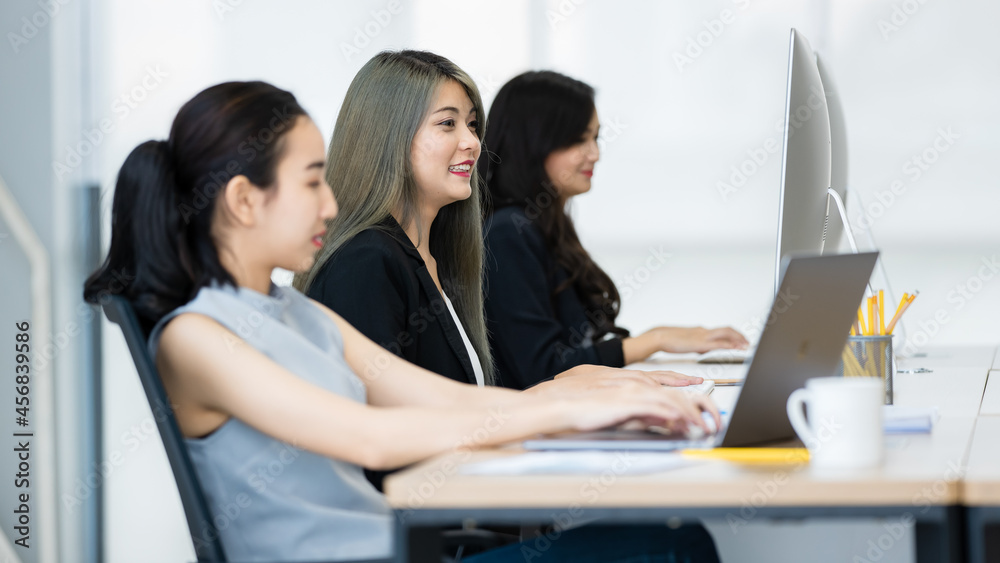 Asian woman working in casual modern office. Asian woman working in casual modern office.