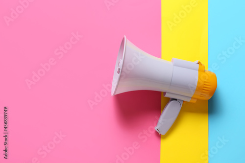 Modern megaphone on color background