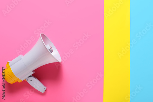 Modern megaphone on color background