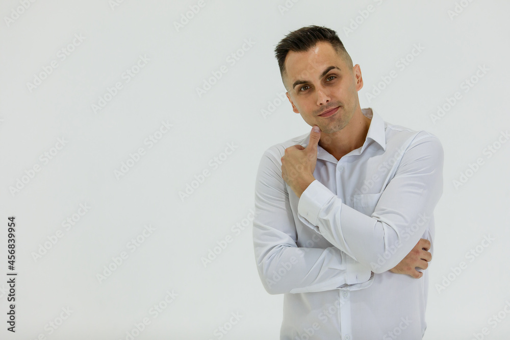 Isolated portrait close up studio shot of Caucasian happy handsome smart confident professional successful businessman entrepreneur in long sleeve shirt stand smile look at camera on white background Isolated portrait close up studio shot of Caucasian happy handsome smart confident professional successful businessman entrepreneur in long sleeve shirt stand smile look at camera on white background