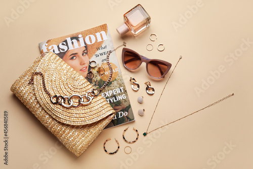 Set of female accessories and magazine on color background photo