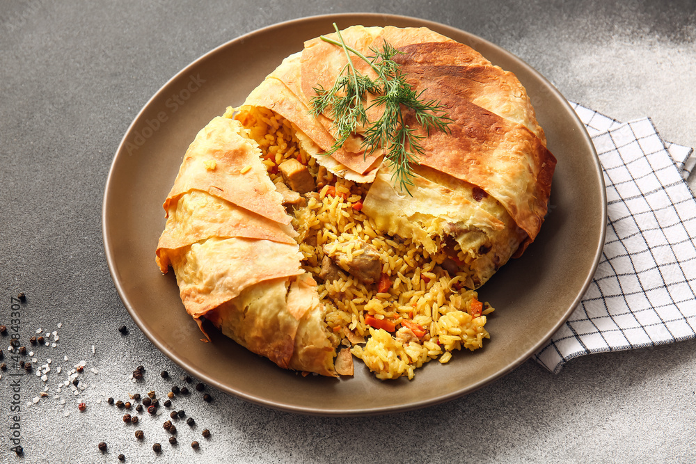 Plate with tasty Shah Pilaf on black and white background Plate with tasty Shah Pilaf on black and white background