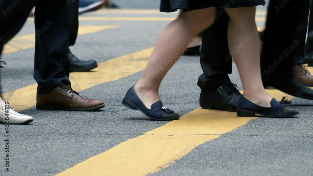 Close up of people walking on crowded street in slow motion. Close up of people walking on crowded street in slow motion.