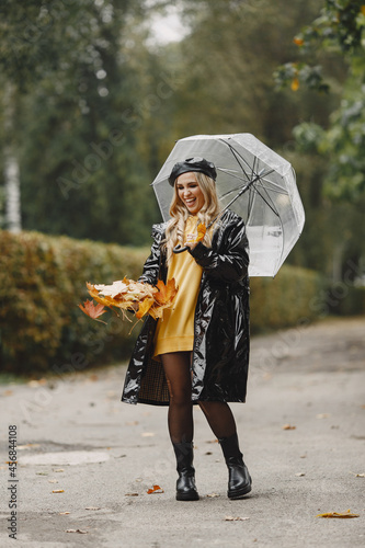 Elegant woman in a autumn park