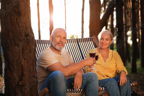 Mature couple drinking wine...
