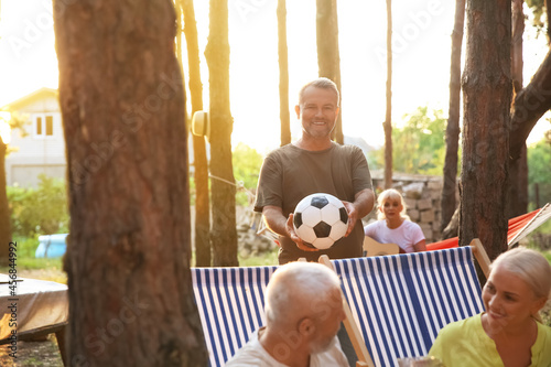 Mature man with ball at bar...