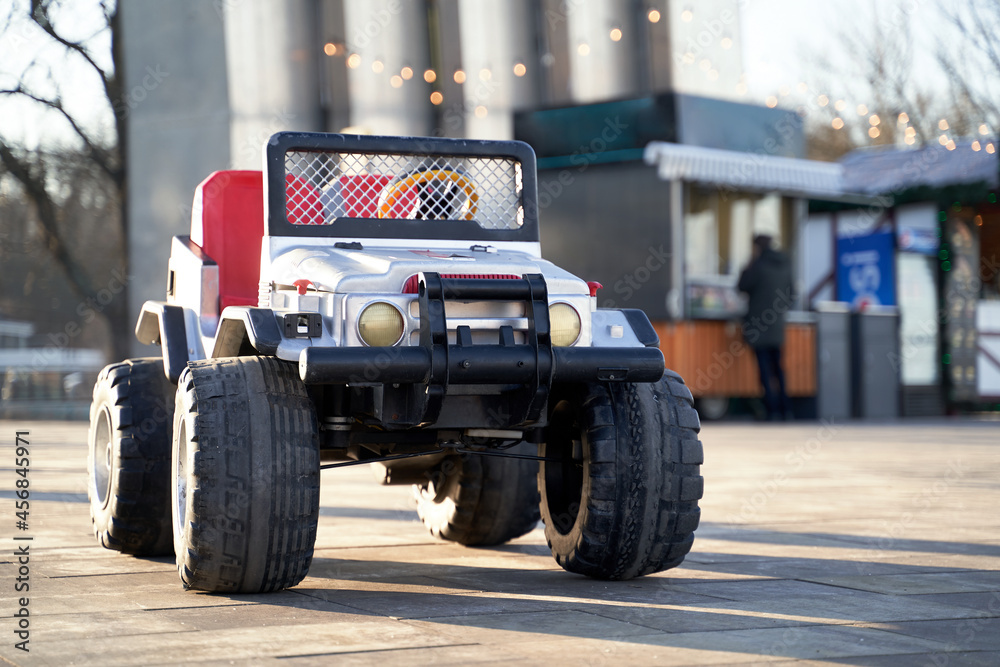Plastic Toy car outdoor in the city in sunlight