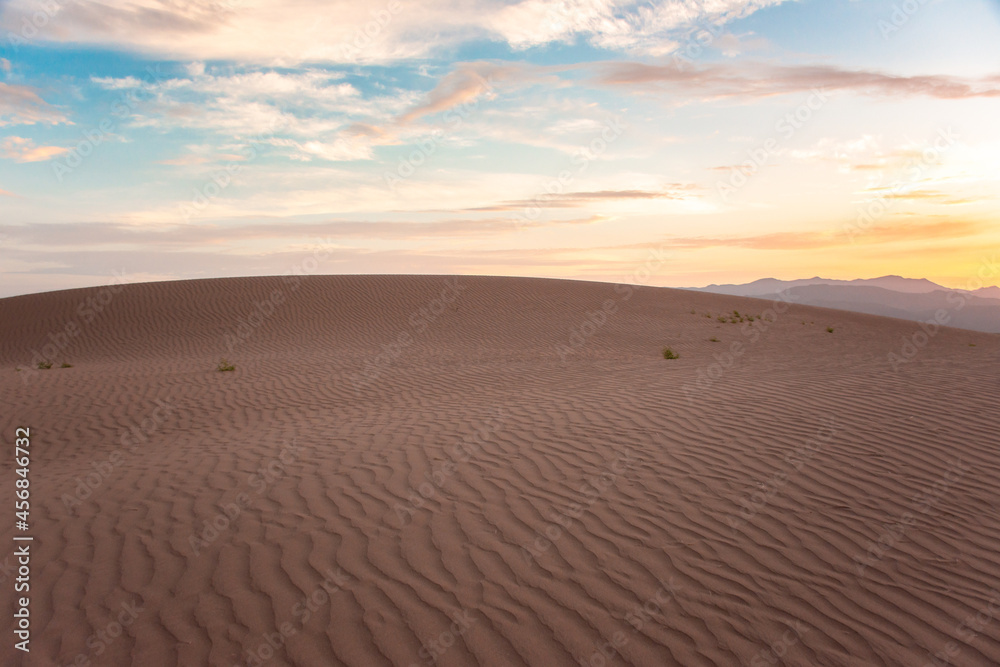 Empty Desert dunes at sunrise