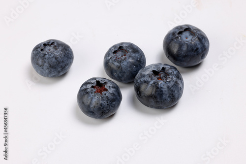 Fresh ripe deep purple Blueberry on white background macro closeup
