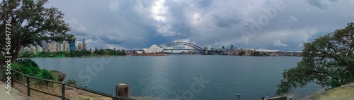 View if Sydney Harbour Circular Quay NSW Australia. Ferry boats partly cloudy skies blue waters