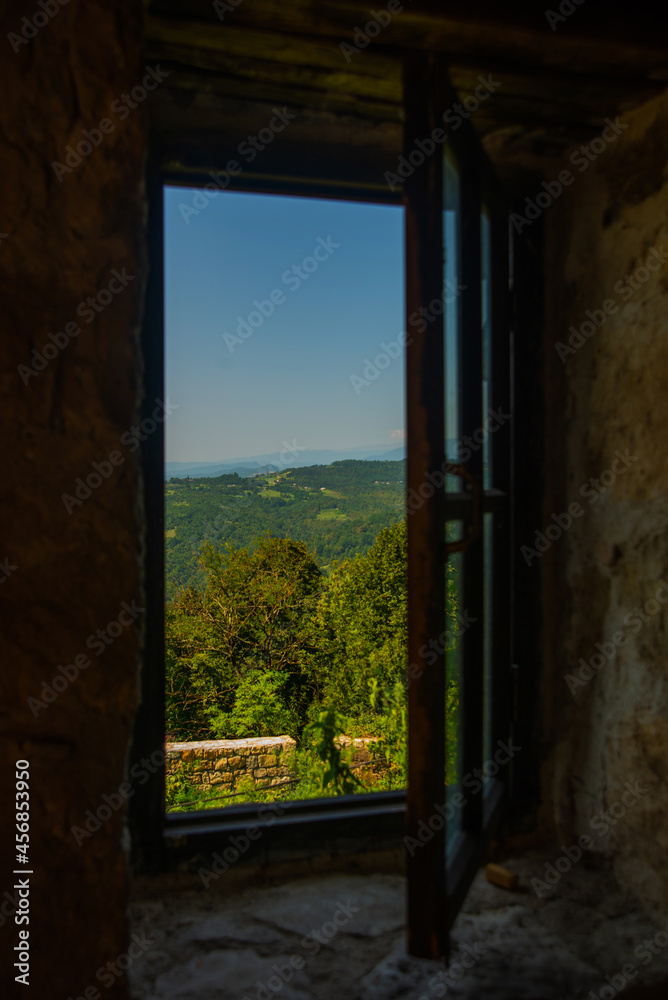 KUTAISI, GEORGIA: Beautiful landscape with views of the hills and mountains in Gelati Monastery on a sunny summer day.