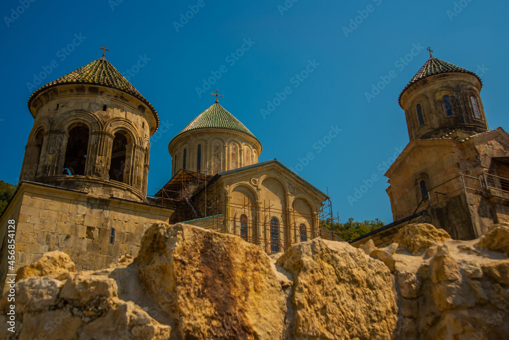 KUTAISI, GEORGIA: Landscape with a view of the Gelati Monastery on a sunny summer day in the background of the blue sky.