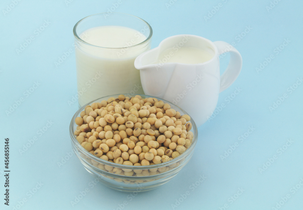 Soy beans and soy milk on blue background Soy beans and soy milk on blue background