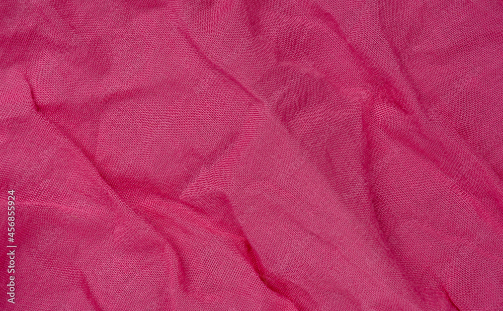 Fototapeta premium wrinkled pink fabric texture background closeup