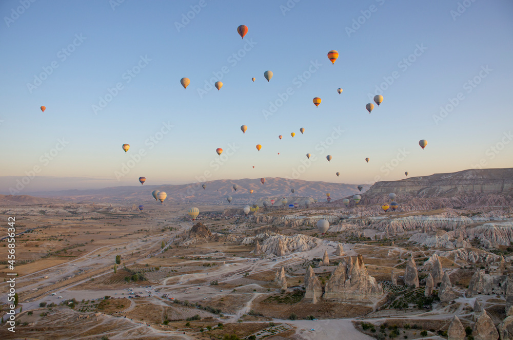 Balloon in the sky with people in Cappadocia Balloon in the sky with people in Cappadocia
