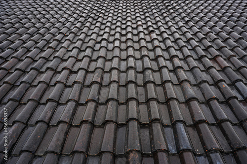 Black roof of the house tile arrangement