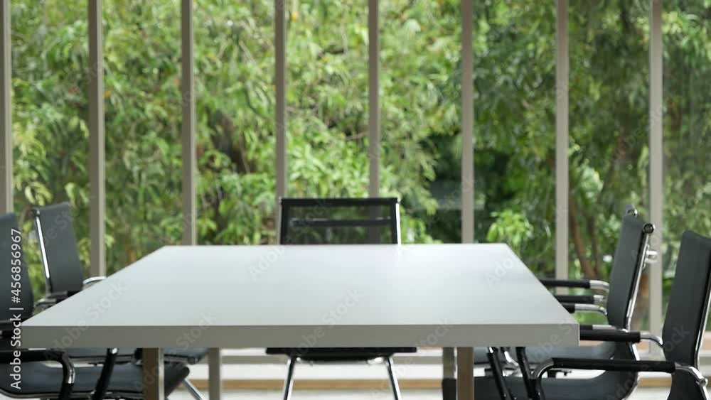 Office meeting board room no people Empty with eco green view natural. Conference room office for shareholder team. White wood table black chair funiture green background. 