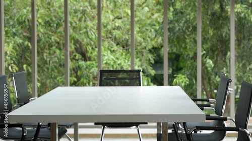 Office meeting board room no people Empty with eco green view natural. Conference room office for shareholder team. White wood table black chair funiture green background. 