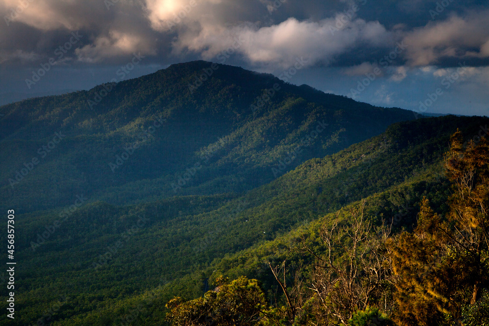 Mountain range in Beautiful light with clouds in Qld Australia Mountain range in Beautiful light with clouds in Qld Australia